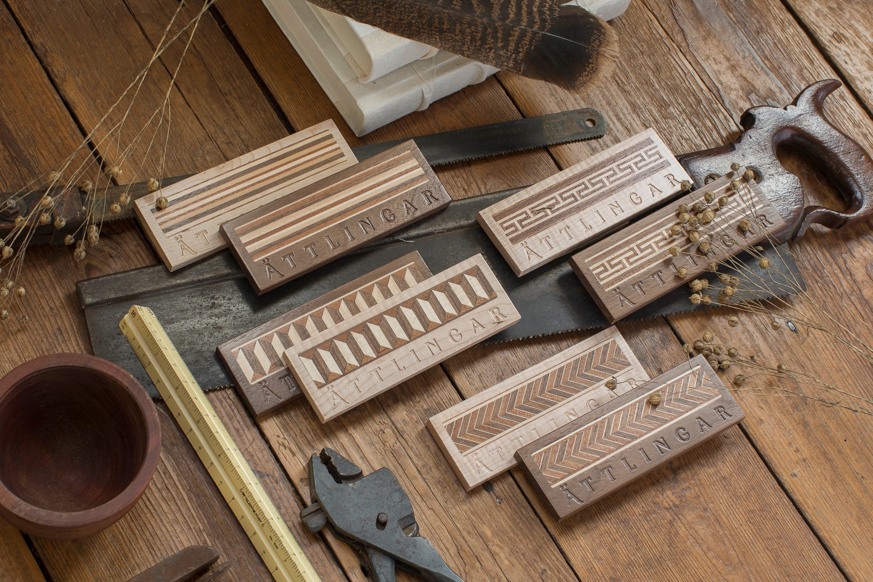 Shop All - Ättlingar Photo of wood samples with attlingar branding
